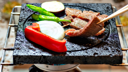 Japanese,Barbecue,,Grilled,Meat,And,Vegetables,On,A,Lava,Stone